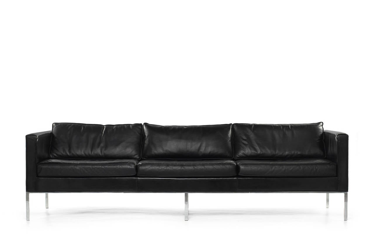 3 seat sofa by Artifort, Holland 1964. Nice minimalistic design. The sofa is upholstered in black leather and stands on a sleek chrome base. This is an early production purchased in 1964. The sofa is in a good original condition and has a very nice