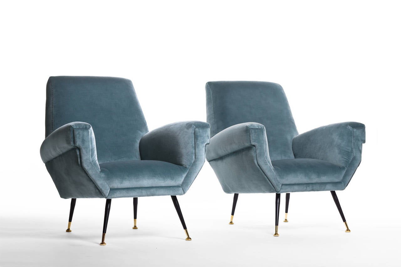 Beautiful pair of Italian lounge chairs, 1950s. Very elegant form and chique brass legs. Reupholstered in a high quality blue mohair velours, providing a very comfortable and soft feeling. In excellent condition.