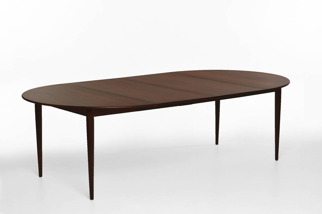 Exclusive dining table by Grete Jalk for P. Jeppesen, Denmark 1960's. High Quality piece made of the finest Brazilian Rosewood with extreme precision. Beautiful continuous wood grain and nice solid edges. 
The table can be used in three lengths: