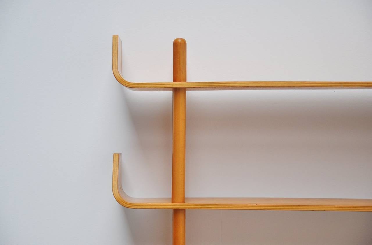 This is for a famous and nice bentwood bookcase is model number 545 and designed by Willem Lutjens for Gouda Den Boer in 1953. This is for the beech plywood version with unicolor beech sticks. This nice light wood is easy to combine with other warm