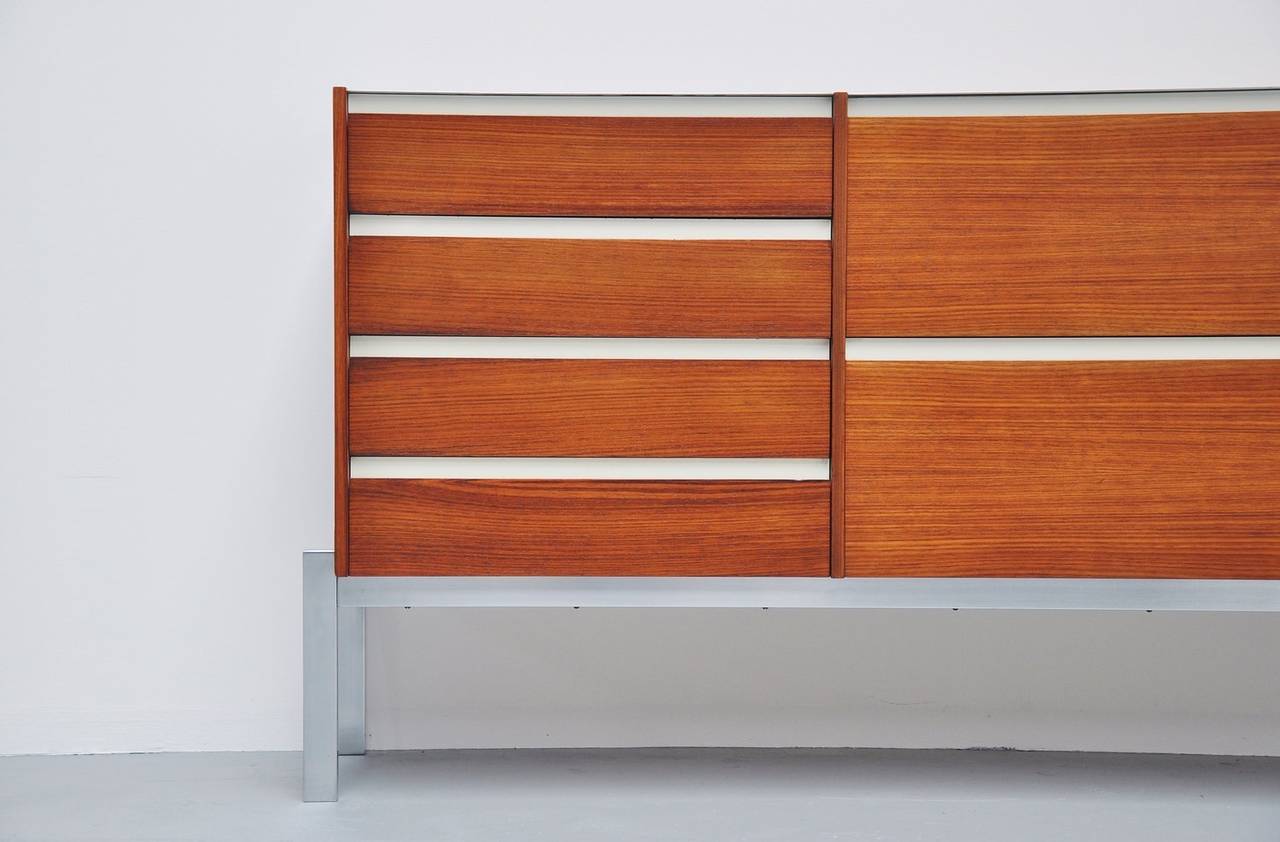 Rare and super elegant piece of Dutch modernism design. This small sideboard or credenza is designed by Kho Liang Ie & Wim Crouwel for Fristho in the early days, Franeker, 1957. This fantastic rosewood sideboard has nice details, chrome-plated metal