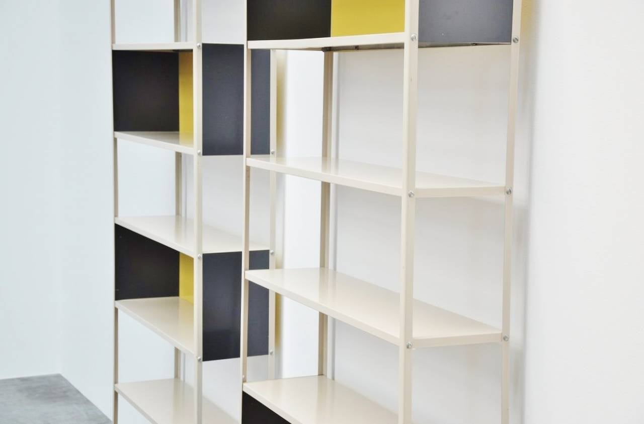 Rare metal bookcase shelving units designed by Friso Kramer for De Bijenkorf, produced by Asmeta in 1953. Martin Visser commissioned Friso Kramer to design a simple usable shelving unit for De Bijenkorf. These bookcases were designed in the colors