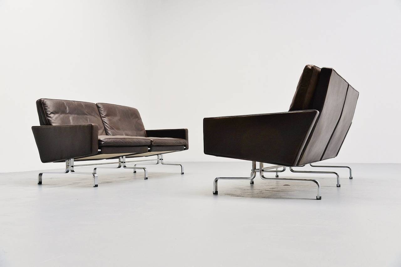 Pair of settees designed by Poul Kjaerholm for E Kold Christensen, Denmark 1958. The PK 31 was both a lounge chair and a modular seating element that could be joined in groups to create a variable length. Two chairs produced the two-seat sofa, PK