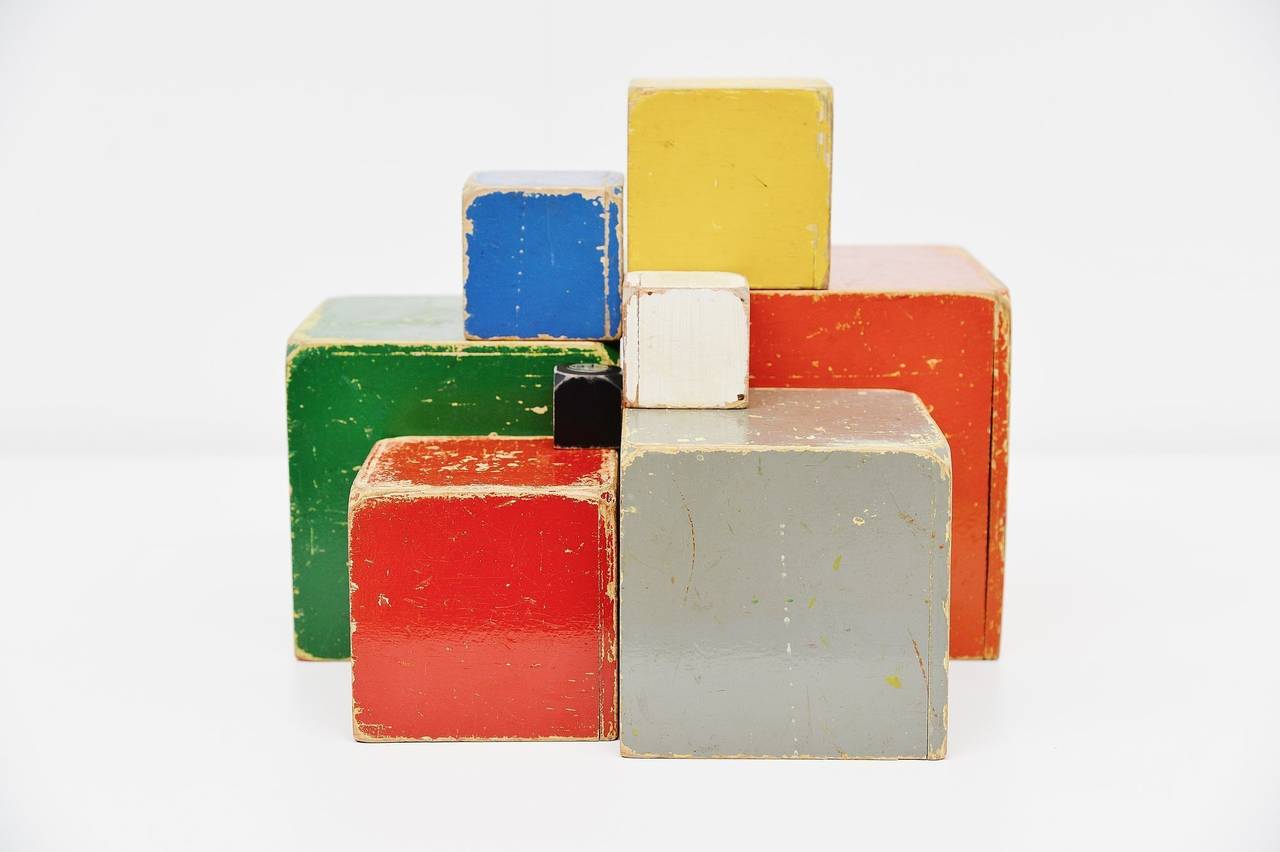 Very rare eight-pieced decorative wooden toy cubes set, designed by Ko Verzuu for Ado Holland in the 1950s. Ado means Arbeid door onvolwaardigen, translated; labor by incapacitated, which makes this an even more special piece. Toys by Ado are being