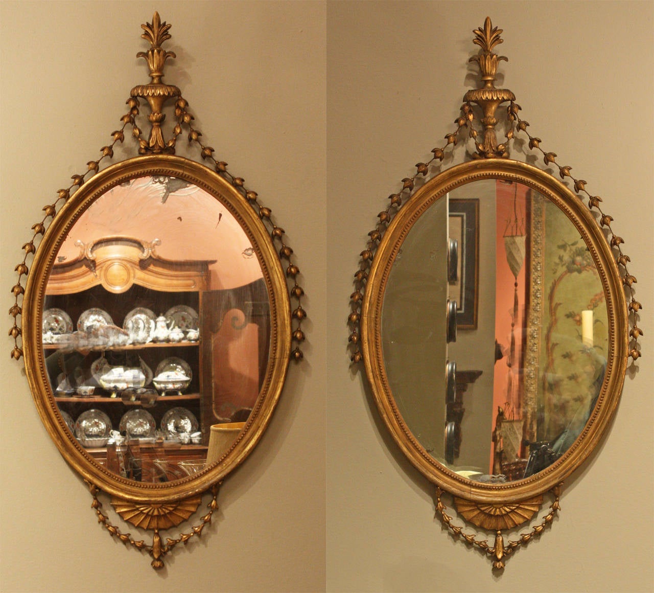 These mirrors retain their original mirror plate and are in excellent condition with minor restoration to the husk garlands.