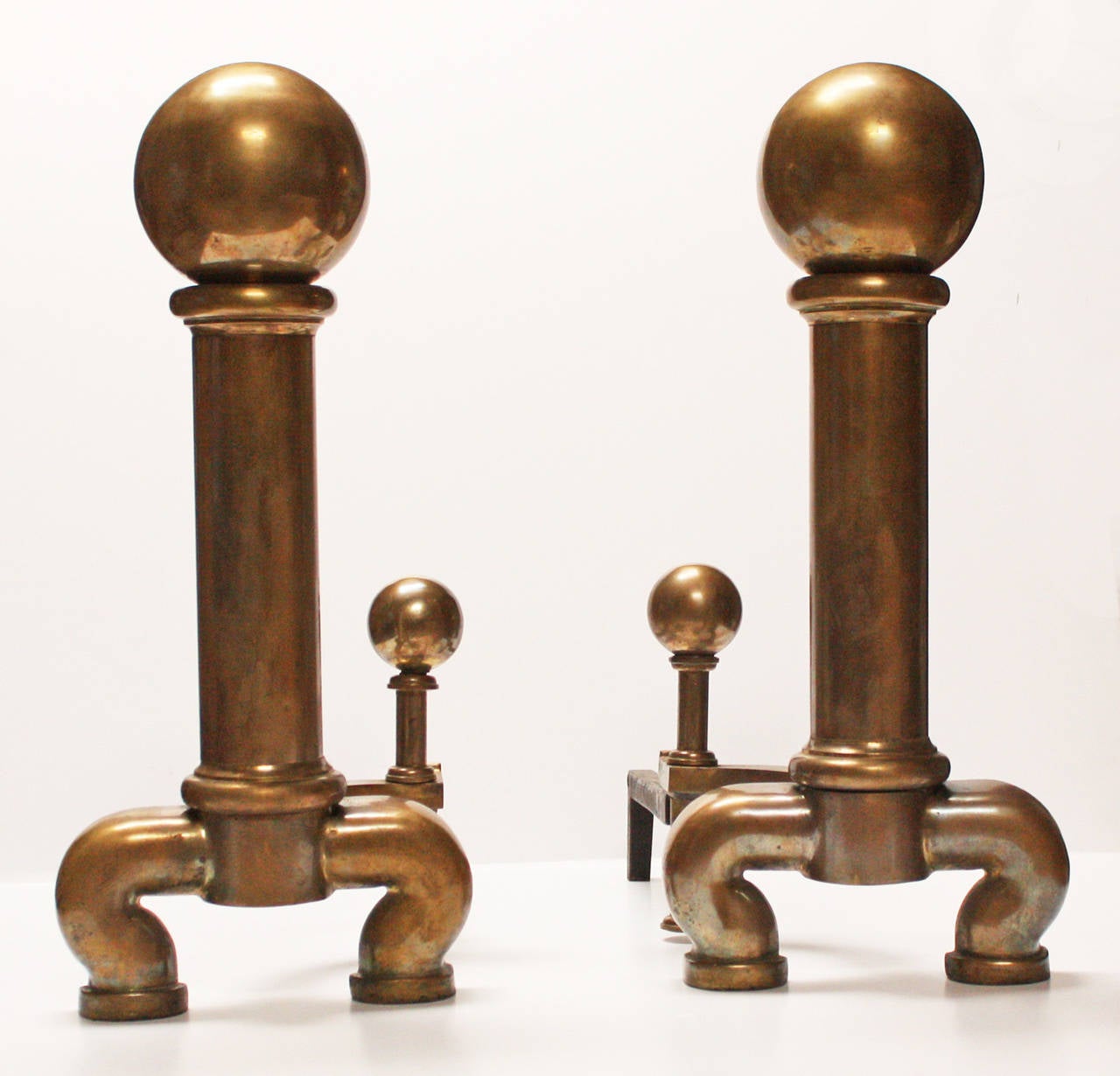 Late 19th century revival cannonball brass andirons.