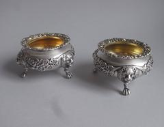 WILLIAM BATEMAN II. An exceptional pair of George IV Lion Mask Salt Cellars
