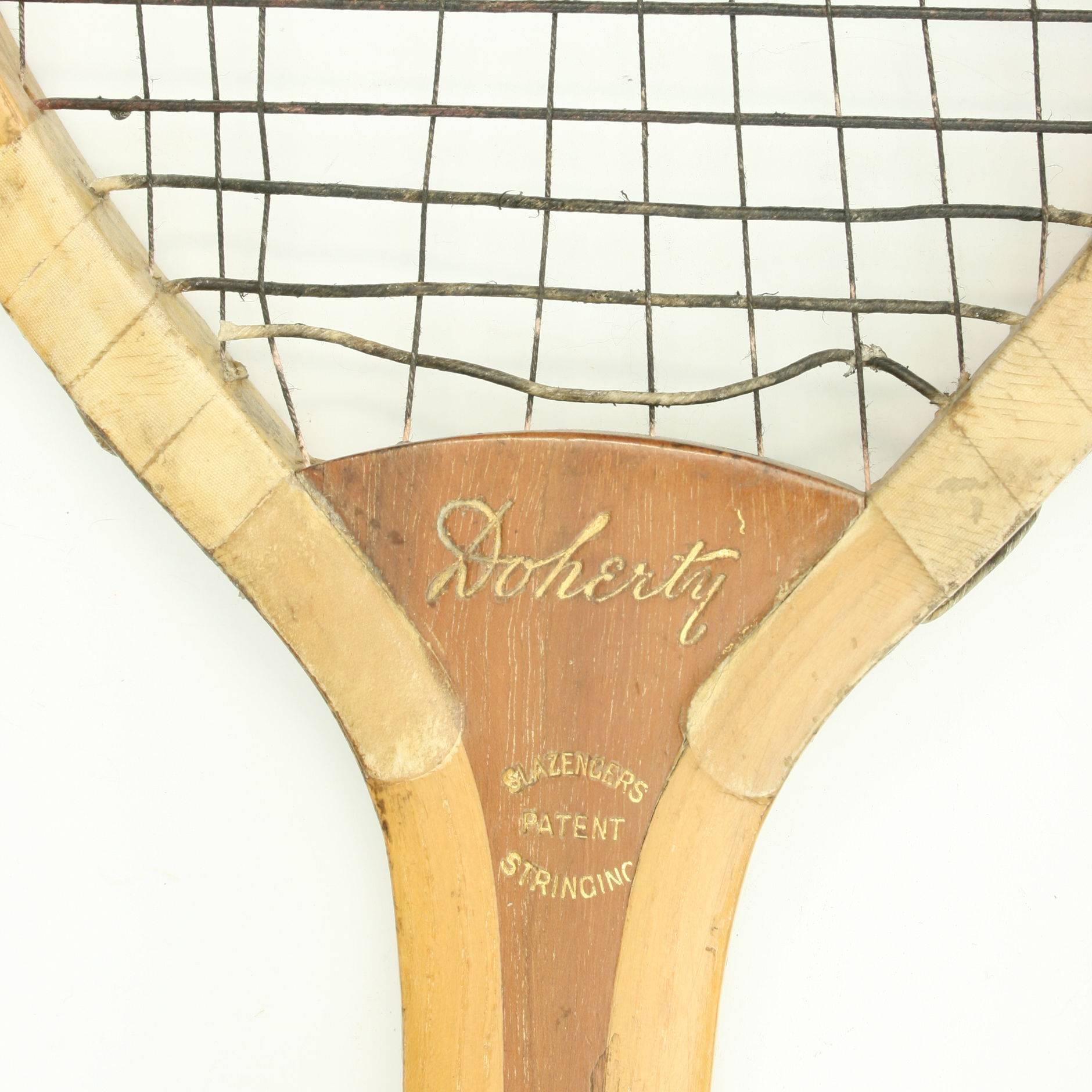 Vintage lawn tennis racket, Doherty 
A fine Lawn Tennis racket by Slazenger in good condition with patent shoulders. The stringing has at some stage been replaced with string. the horizontal stronger than the vertical.The racket is also stamped