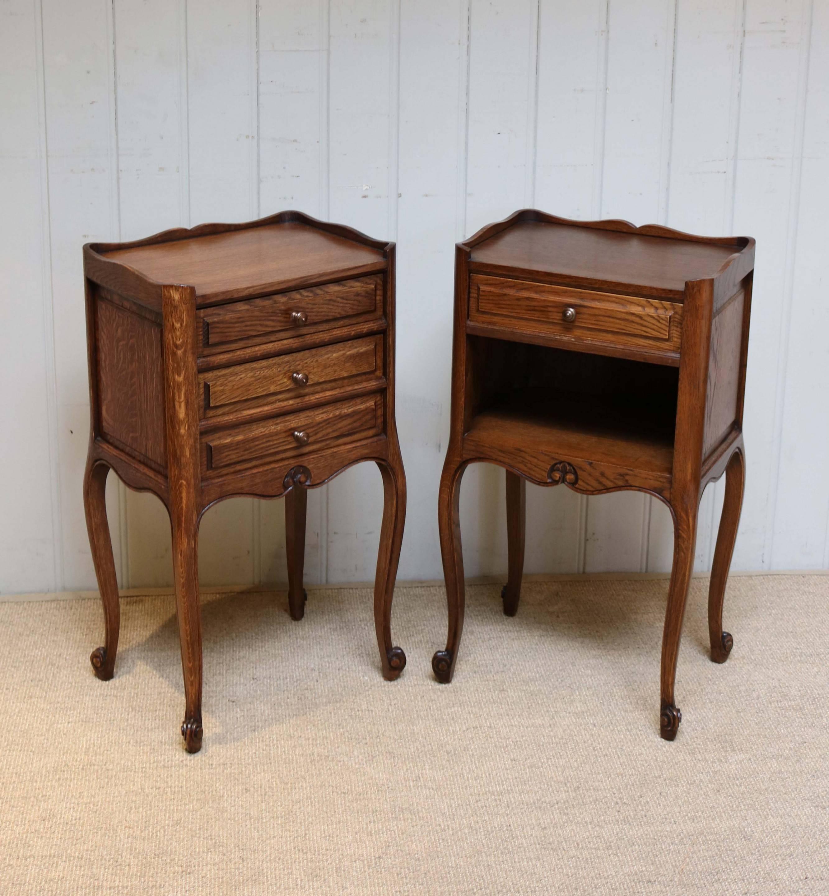Pair of French oak bedside cabinets. One having three drawers, whilst the other has a single and open cupboard base. Both raised on cabriole legs.