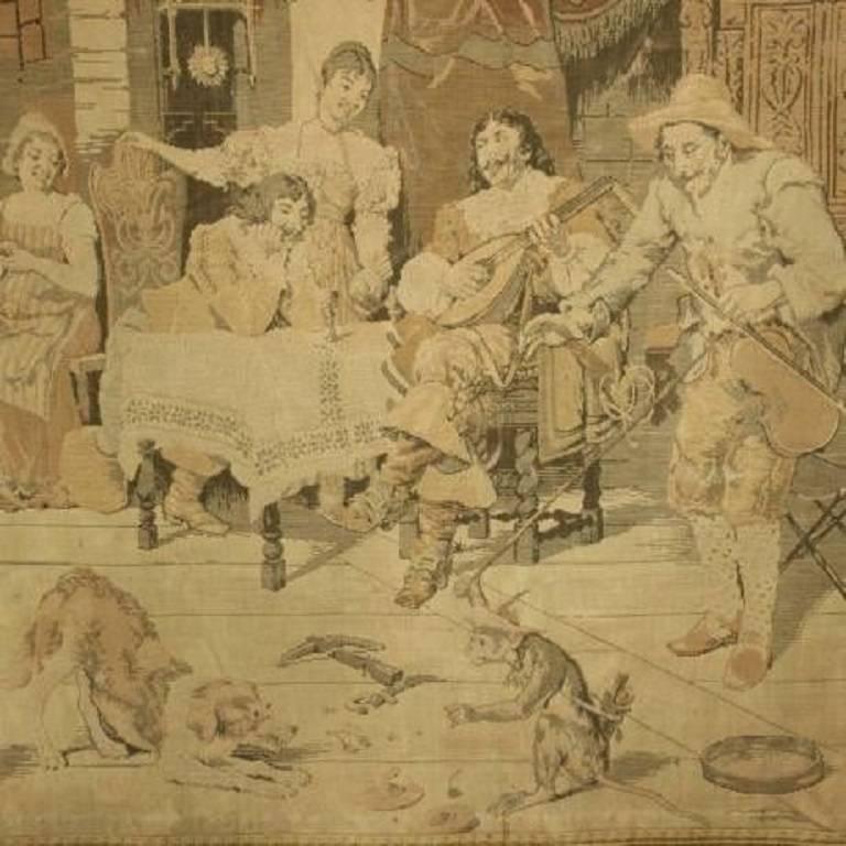 A large and attractive continental wall hanging tapestry. The colors have faded, but this does nothing to take away its charm, if anything it adds to it. The scene is in a great hall with a roaring fire in the background. There is a group of