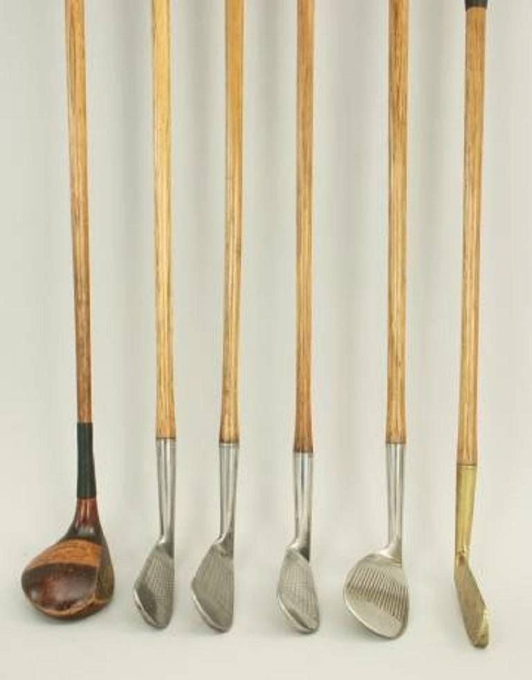 A good playable set of six hickory shafted golf clubs consisting of Brassie, four iron, two mashies, niblick and a brass blade putter. The clubs are in excellent original condition with a mix of new and old grips. The face markings are a mixture of