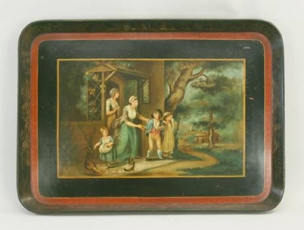 A charming hand painted 19th century papier mâché tray. The tray is very well painted with a Victorian scene in the centre and gold decoration on the border with a red border in between.
A fine, very decorative piece.