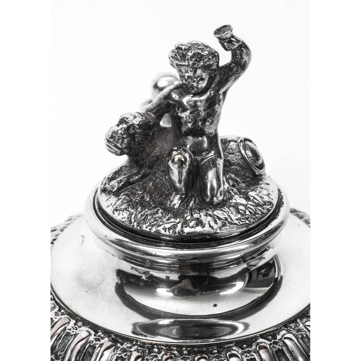 A very attractive silver plate on copper lidded tankard in the Classic English style with fabulous engraved and embossed decoration, circa 1860 in date. 

The hinged lid surmounted with a cherub &lion form finial, the body superbly decorated