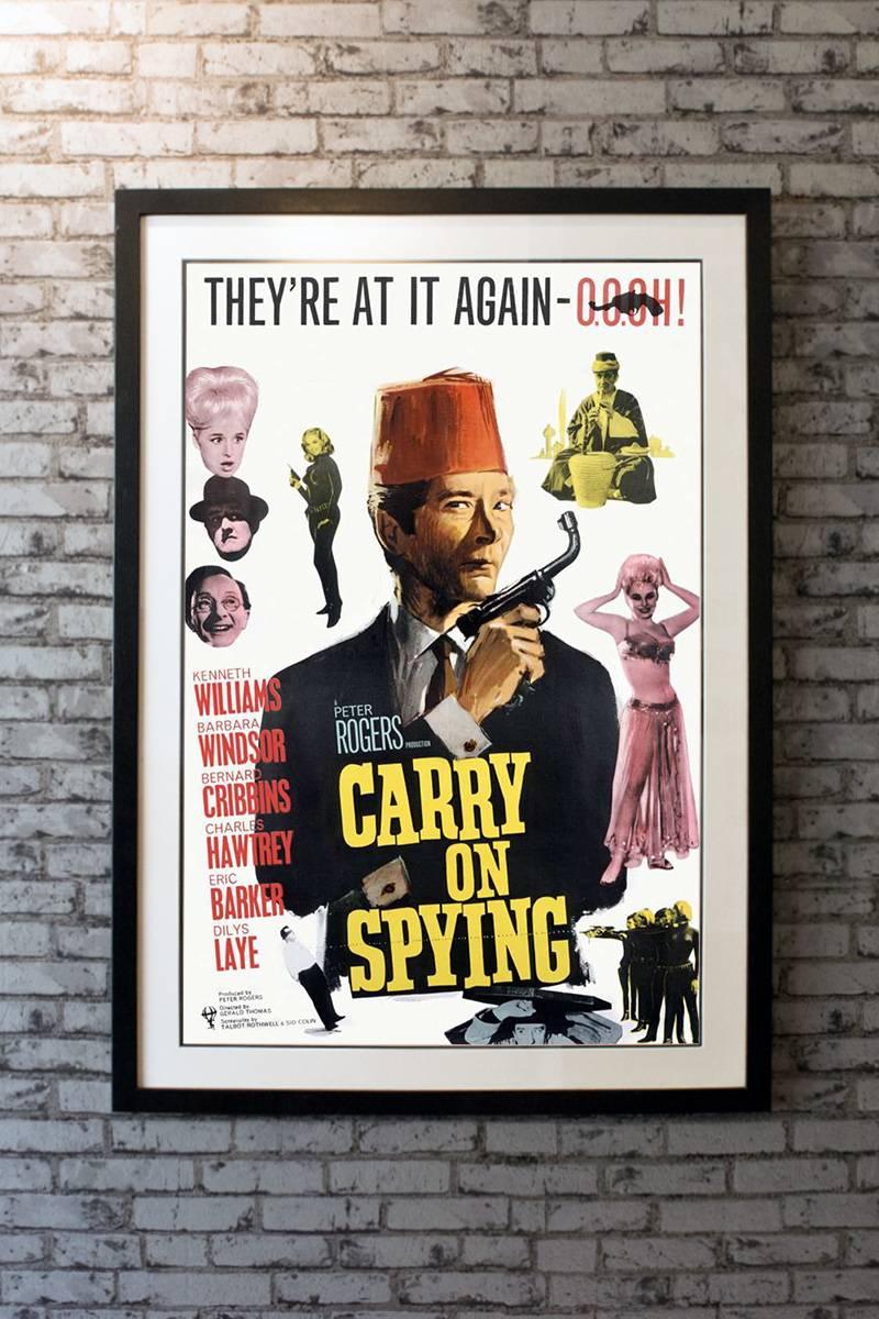 A British spy (Kenneth Williams) and his pupils are sent to recover a secret formula stolen by an agent of Stench.

Framing options:
Glass and single mount + £250
Glass and double mount + £275
Anti-UV glass and single mount + £350
Anti-UV