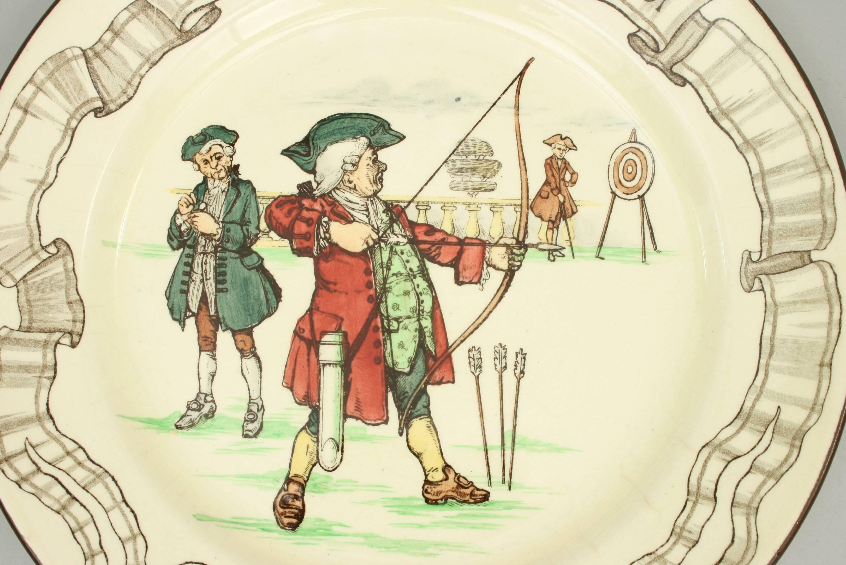 A Royal Doulton 'Old English Games' series wear plate entitled ''The Diversions of Uncle Toby - Toby as a Toxophilite'. The plate is in excellent condition with no chips, cracks or repairs, there is the usual crazing to the glaze as would be