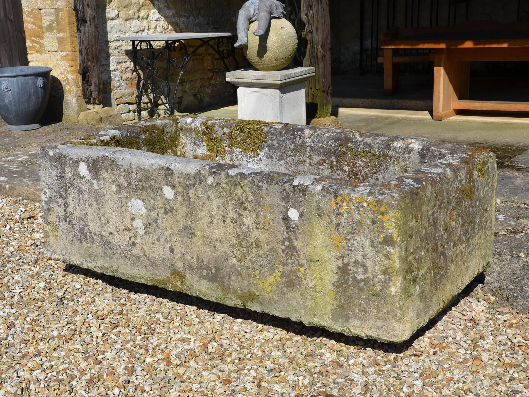 A large antique limestone trough with good weathering and patination.