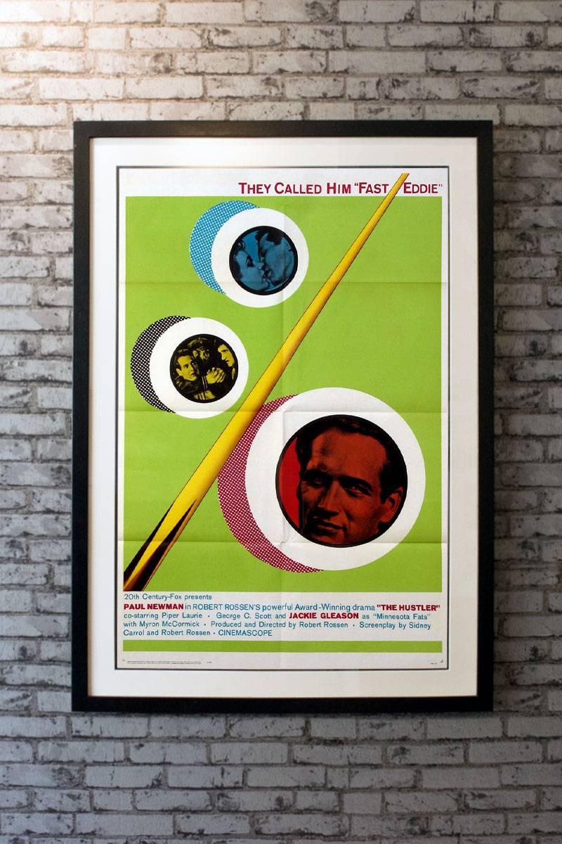 Paul Newman had one of his best roles in this extraordinary film about a pool-playing hustler. This 1964 reissue poster is preferred to the original by many collectors because of its billiards imagery. There is light edge wear on the right border