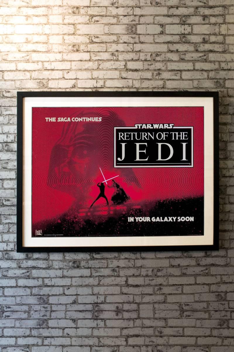 Evocative artwork of the final battle between Luke Skywalker and Darth Vader highlights this striking rare advance poster for the UK release of the third film from the original trilogy. This poster is doubly rare as it is rolled in near mint