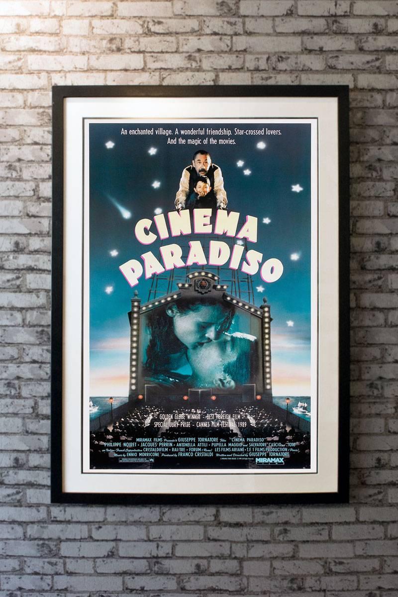 A filmmaker recalls his childhood, when he fell in love with the movies at his village's theater and formed a deep friendship with the theater's projectionist.

Framing options:
Glass and single mount + £250
Glass and double mount +