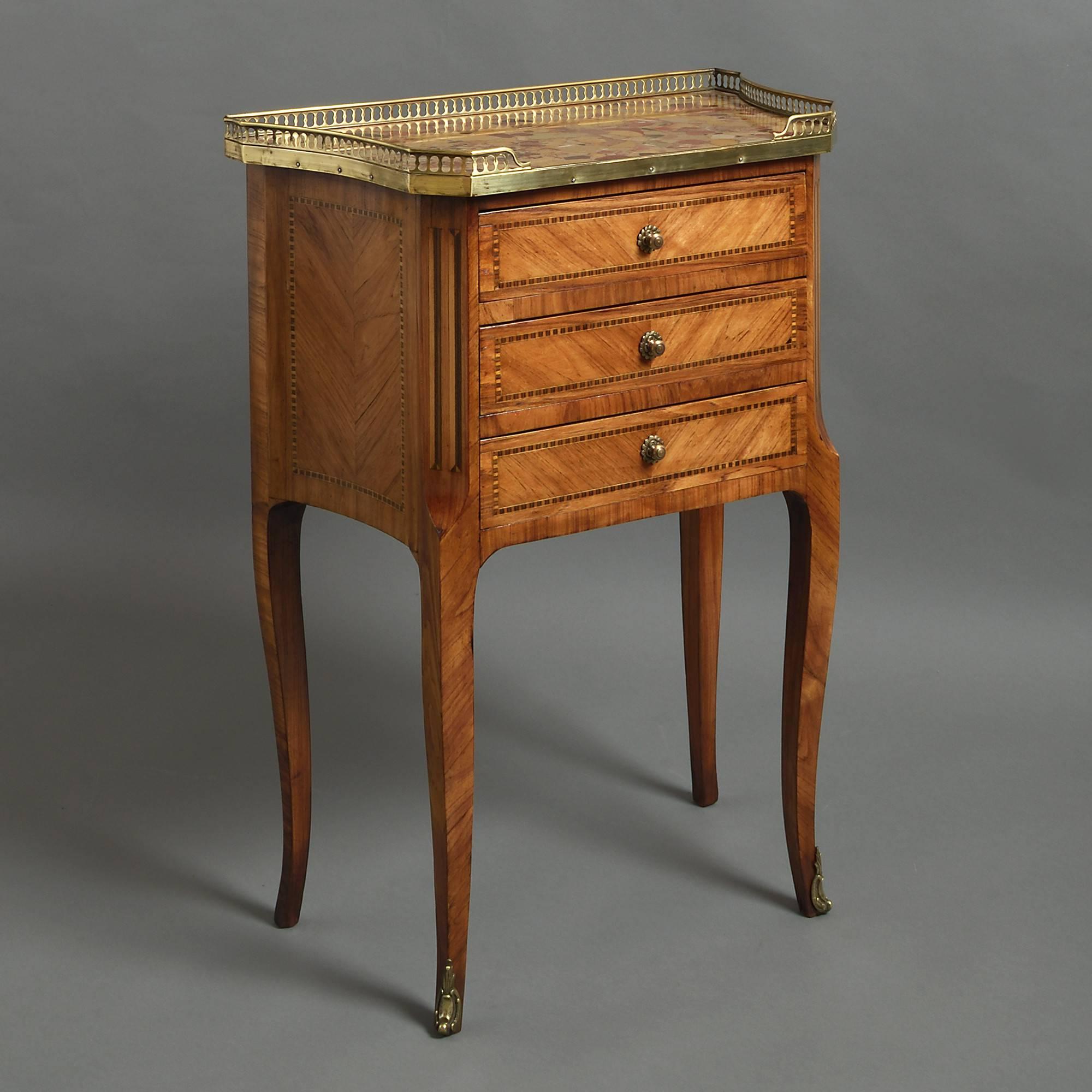 A fine pair of kingwood parquetry bedside cabinets, each having an inset marble top with pierced brass gallery, above three drawers with finely chased brass knobs and raised upon shaped legs with brass mounts.