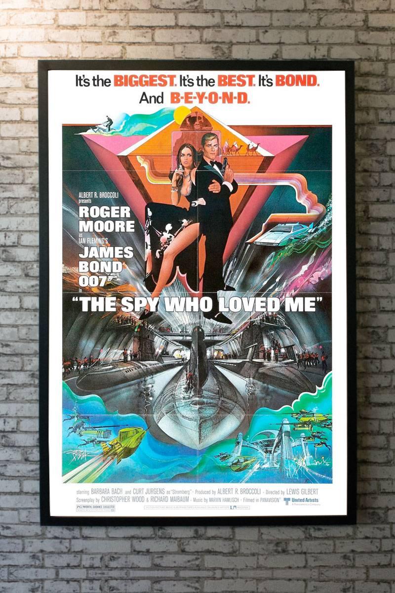 Artwork by Bob Peak. The Spy Who Loved Me is the tenth spy film in the James Bond series, and Roger Moore’s third appearance as the fictional secret agent James Bond. It was shot on location in Egypt and Italy, with underwater scenes filmed in the