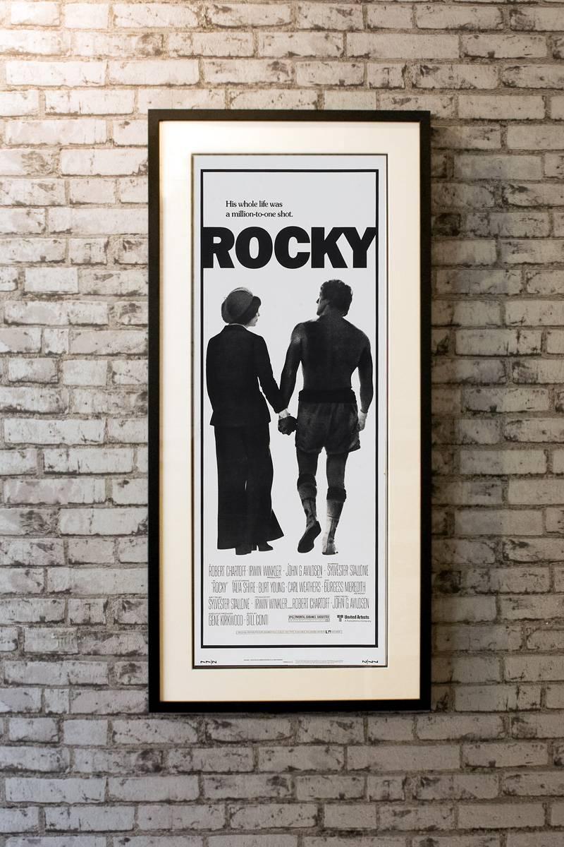 Rocky Balboa, a small-time boxer gets a supremely rare chance to fight the heavy-weight champion, Apollo Creed, in a bout in which he strives to go the distance for his self-respect.

Linen-backing + £100

Framing options:
Glass and single