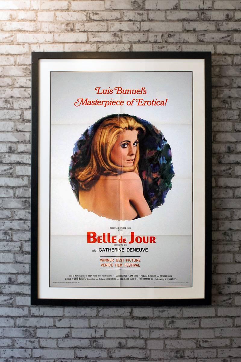 The beautiful Catherine Deneuve stars in this Luis Bunuel film about a young newlywed's secret occupation. A shocking subject for its day, this poster depicts its star in a lovely portrait. 

Linen-backing + £150

Framing options:
Glass and