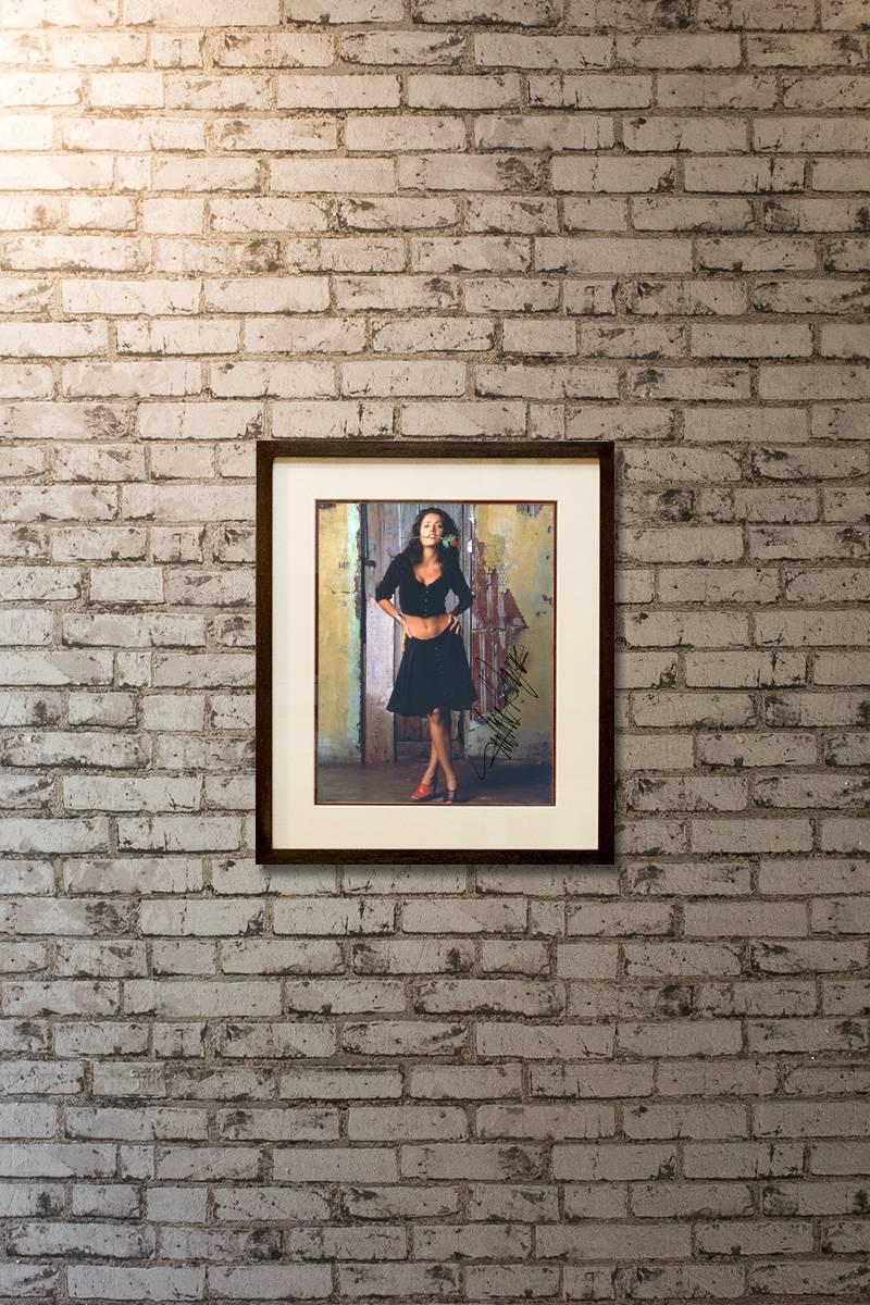 This photo has been signed by actress Salma Hayek. This autograph was obtained is person by our reputable supplier. All of our autographs are 100% genuine. These autographs are usually obtained at London film premieres, theatres, hotels,