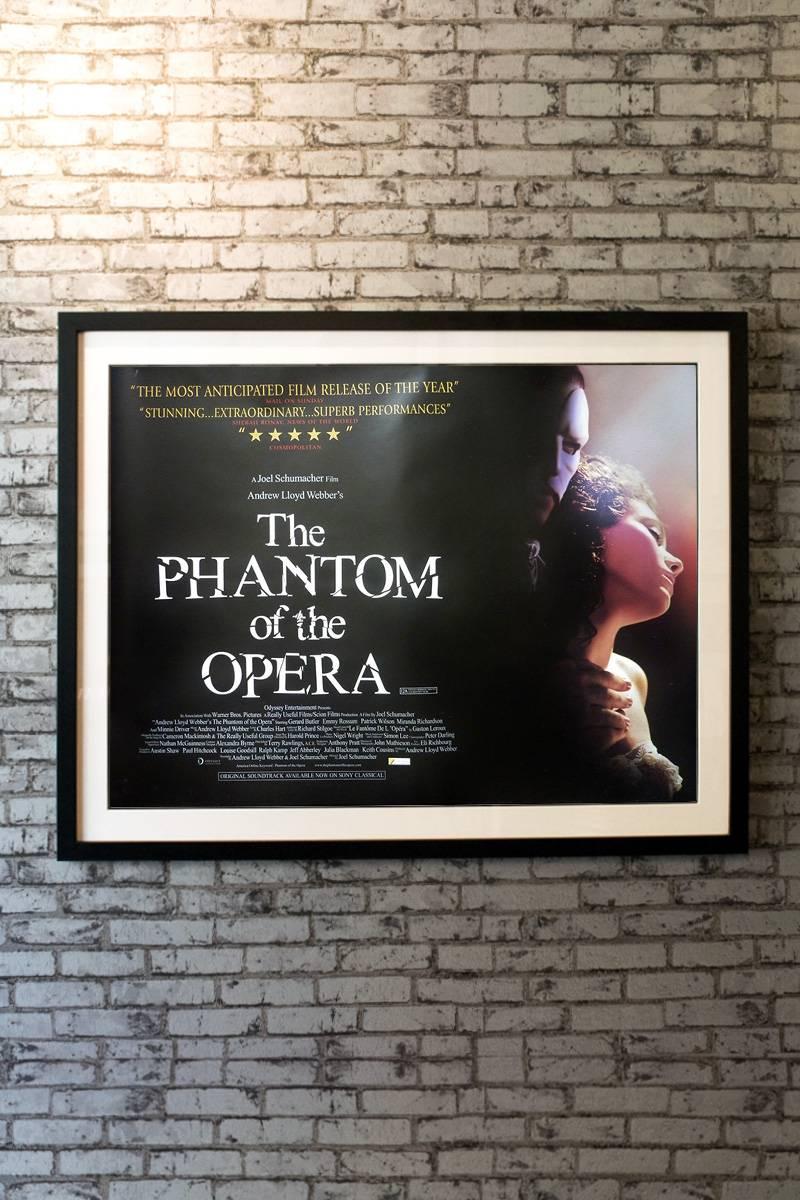 From his hideout beneath a 19th century Paris opera house, the brooding Phantom (Gerard Butler) schemes to get closer to vocalist Christine Daae (Emmy Rossum). The Phantom, wearing a mask to hide a congenital disfigurement, strong-arms management