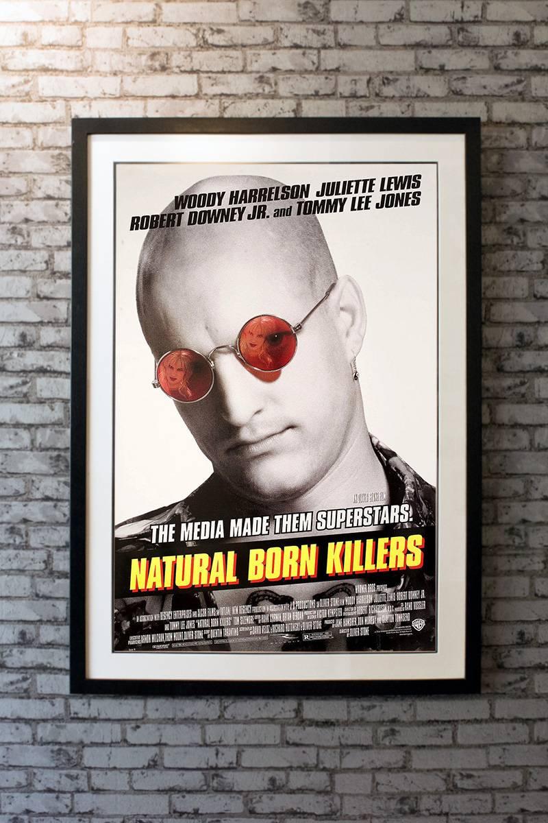 Woody Harrelson and Juliette Lewis are two young, attractive serial killers who become tabloid-TV darlings, thanks to a sensationalistic press led by Robert Downey Jr. The press reports the pair as they go on a 52 people killing spree. A