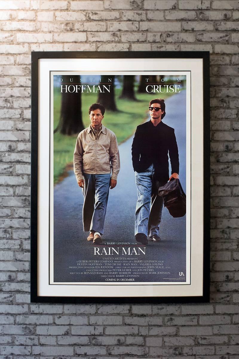 When car dealer Charlie Babbitt (Tom Cruise) learns that his estranged father has died, he returns home to Cincinnati, where he discovers that he has an autistic older brother named Raymond (Dustin Hoffman) and that his father's $3 million fortune