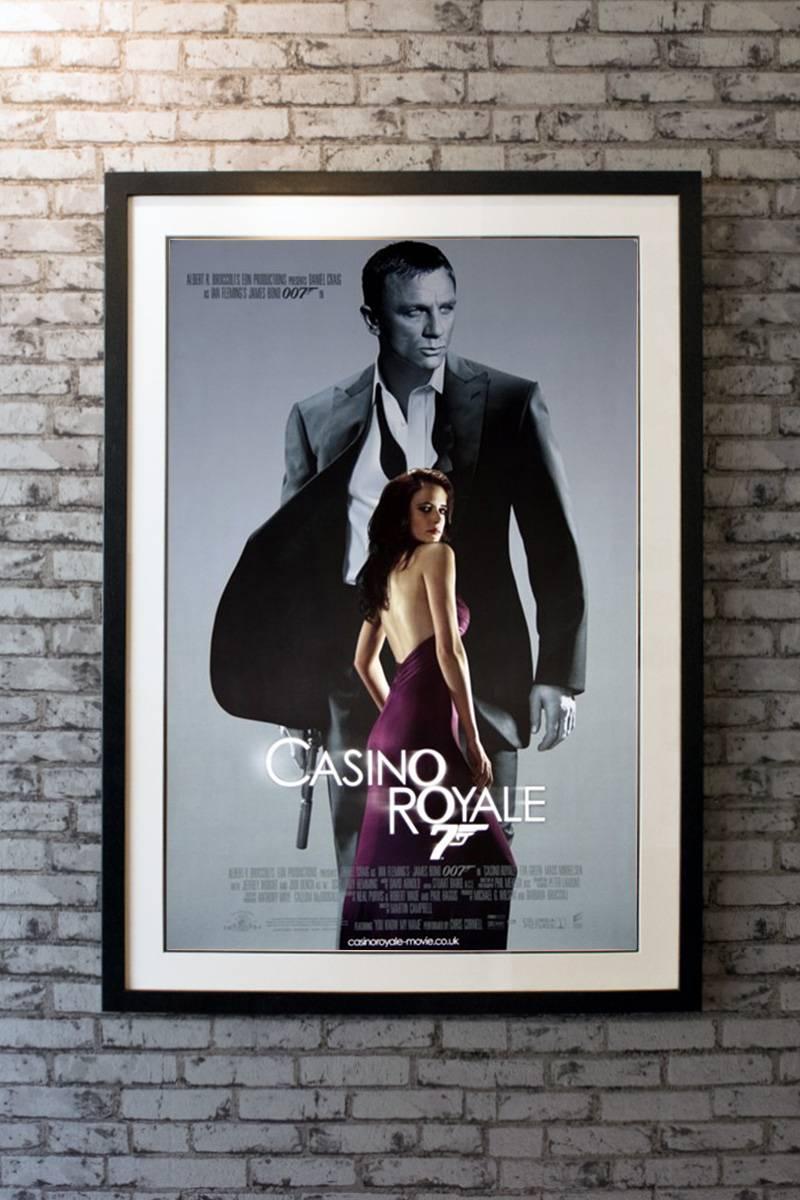Armed with a licence to kill, Secret Agent James Bond sets out on his first mission as 007 and must defeat a weapons dealer in a high stakes game of poker at Casino Royale, but things are not what they seem. 

Linen-backing + £150

Framing