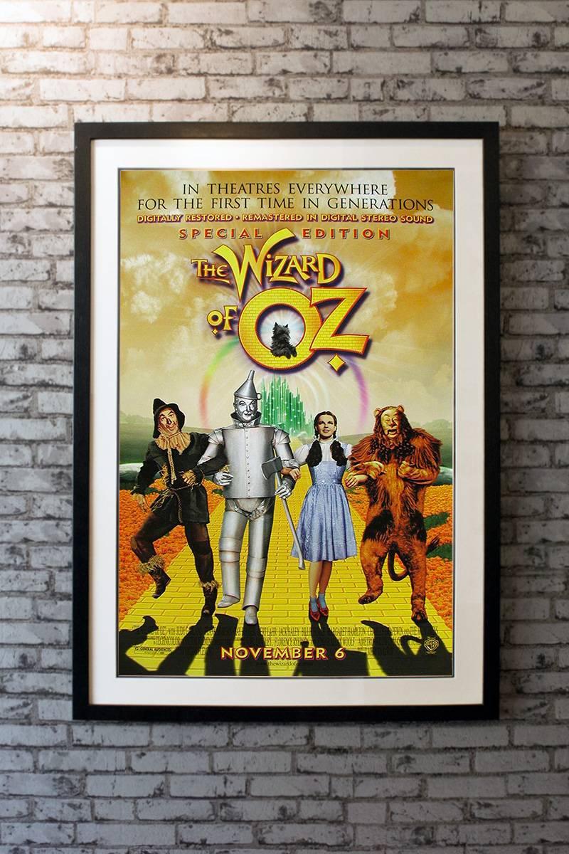 When a tornado rips through Kansas, Dorothy (Judy Garland) and her dog, Toto, are whisked away in their house to the magical land of Oz. They follow the Yellow Brick Road toward the Emerald City to meet the Wizard, and en route they meet a Scarecrow