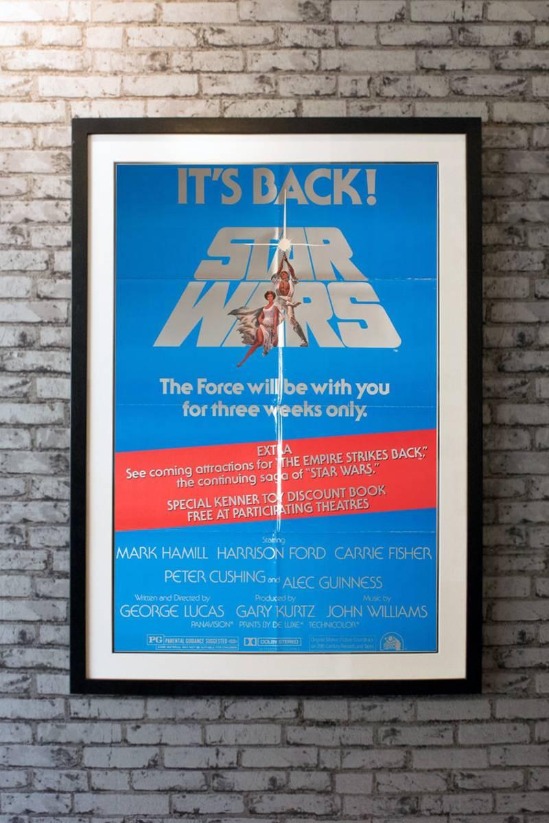Starring Mark Hamill, Harrison Ford, Carrie Fisher, Alec Guinness, Peter Cushing, Anthony Daniels, Kenny Baker, Peter Mayhew, David Prowse and James Earl Jones. Directed by George Lucas. Artwork by Tom Jung. 

Linen-backing + £150

Framing