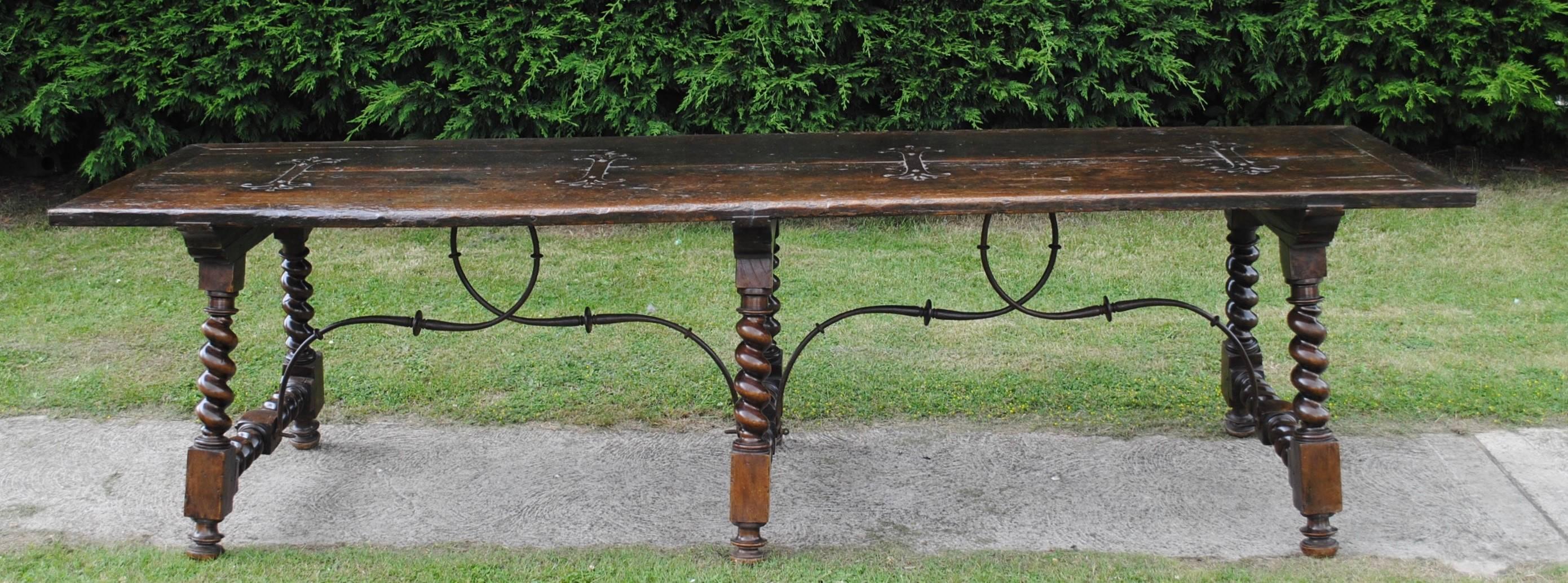 A fine large Spanish walnut refectory table with good metal work and great colour.