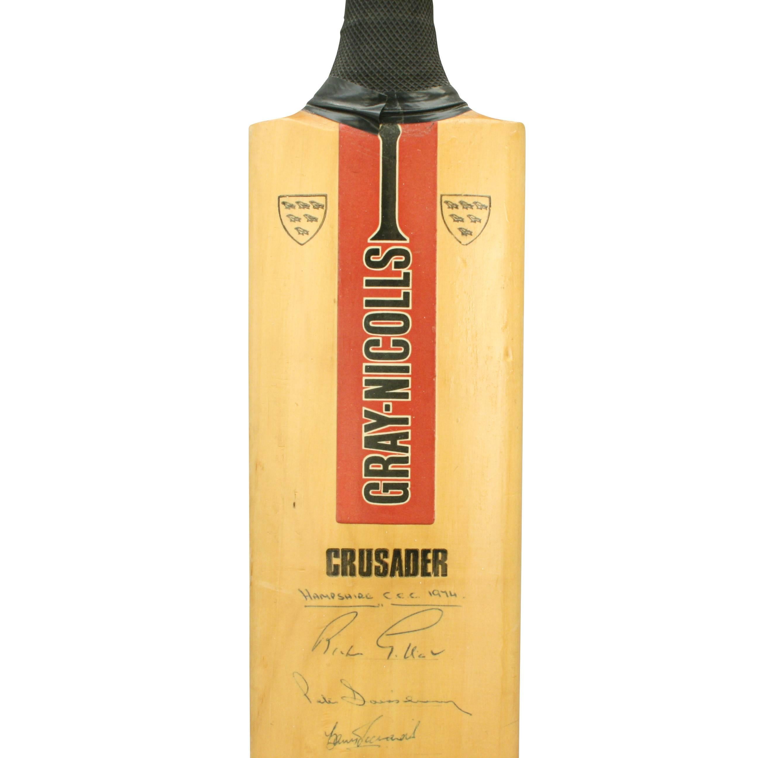 Gray-Nicolls 1974 signed cricket bat. 
A great willow cricket bat with original signatures from the teams of Hampshire CCC, Gloucester, Warwickshire, Leicester CCC and Worcester CCC from the 1974 season. The bat with rubber grip, Grey-Nicolls logo