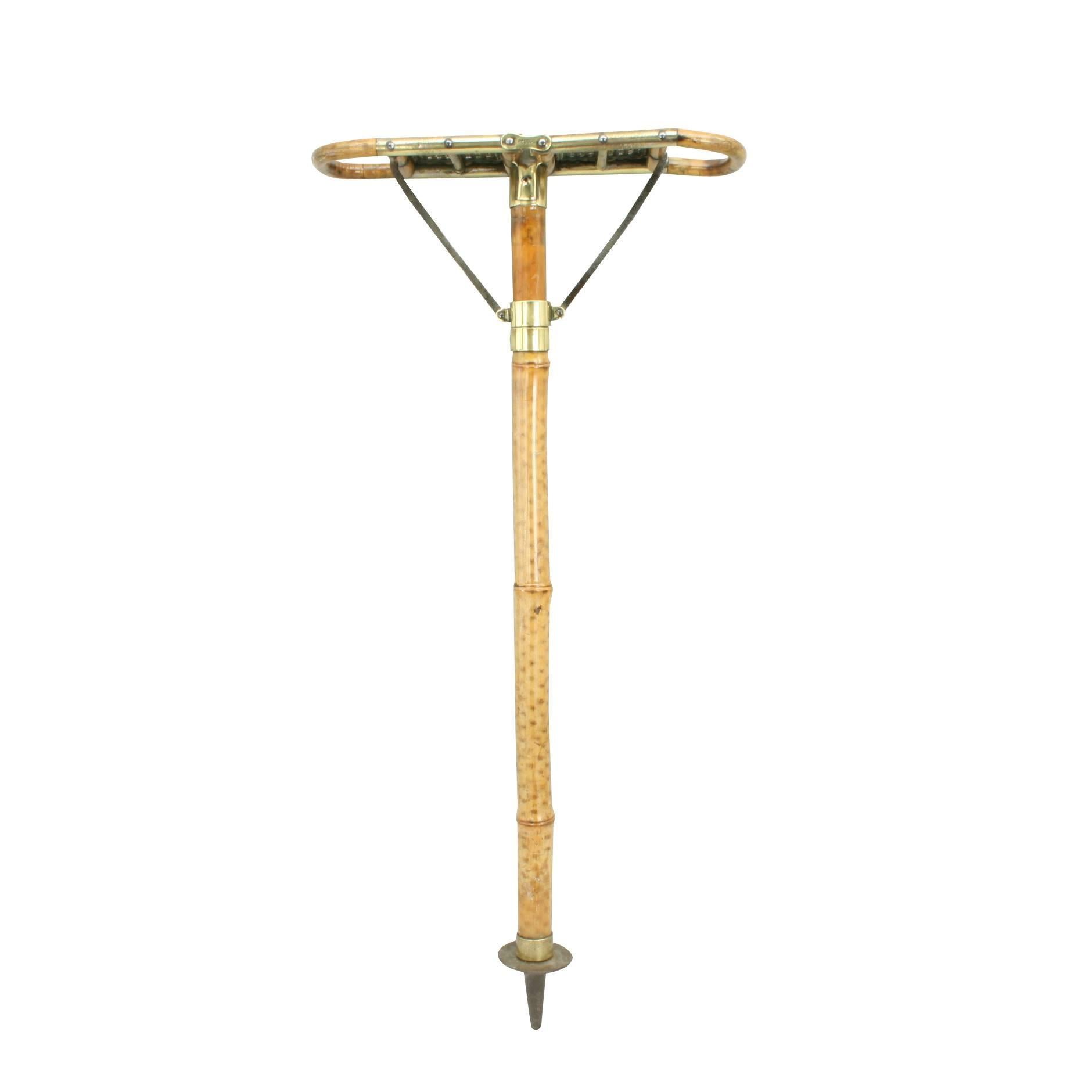 Antique bamboo shooting stick.
A good quality sports seat, shooting stick made of bamboo with folding cane seat and polished brass fittings. There is a metal disc on the bottom to support the seat in soft ground. The stick is in very good original