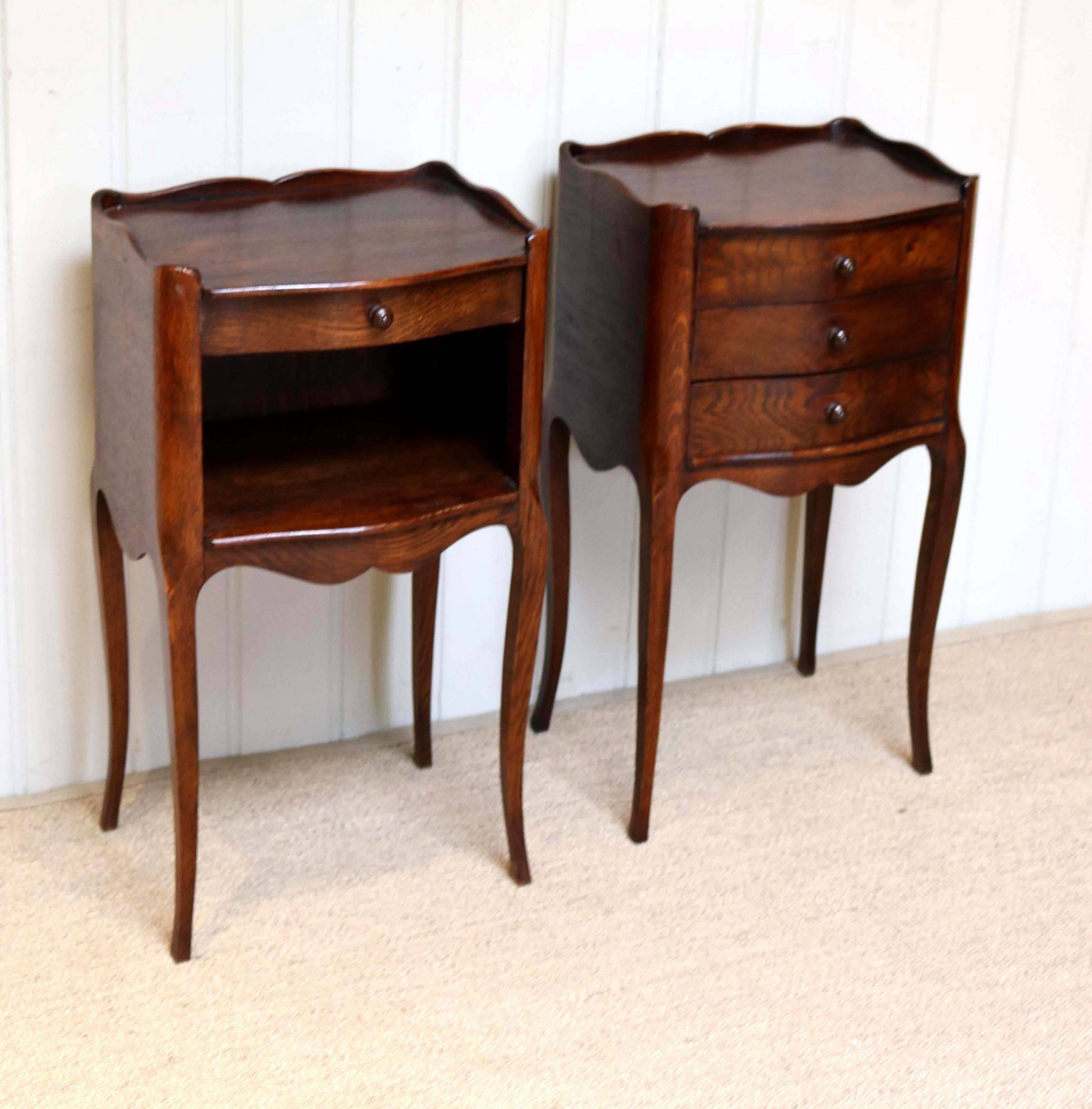 Pair of French oak bedside cabinets one having three drawers the other with a single drawer above an open cupboard base raised on cabriole legs.
