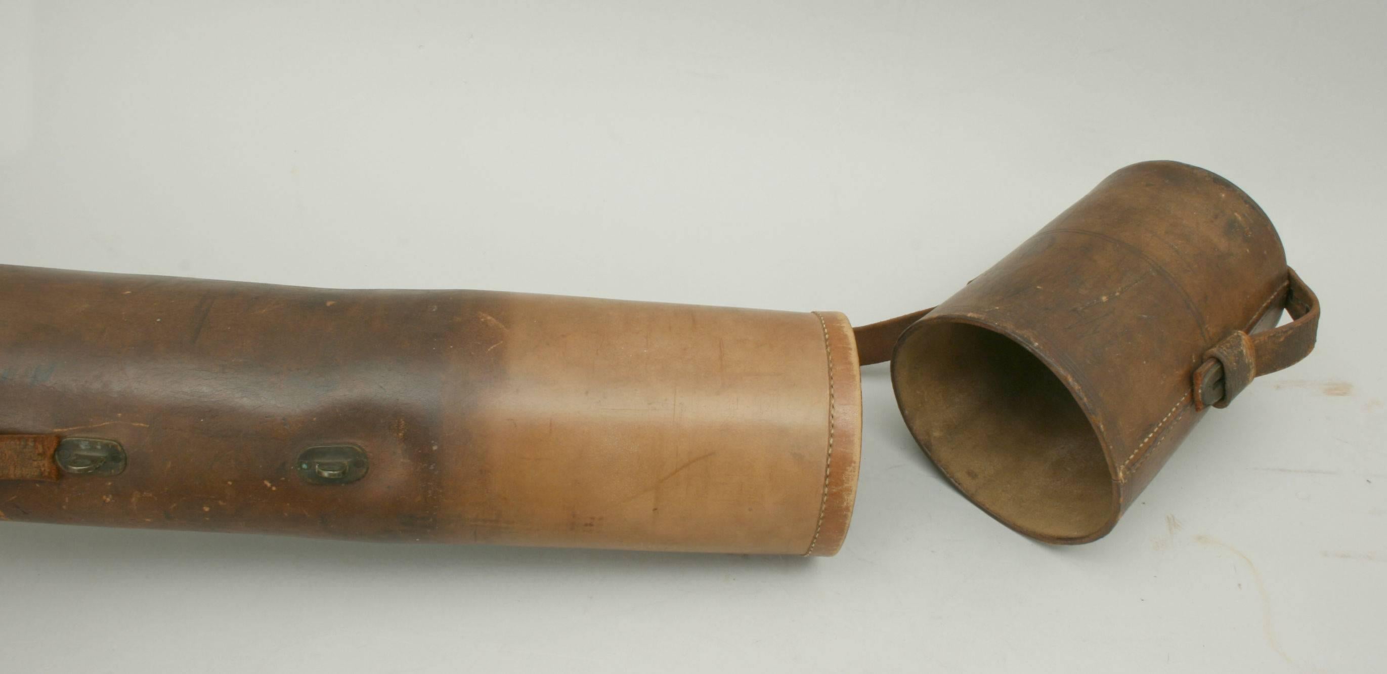 Salmon fishing rod tube.
A rare angler's leather salmon fishing rod tube. The tube is fitted with a removable leather lid with lock strap and brass fittings. It is in good condition with a single strong carry handle. This type of rod tube was used