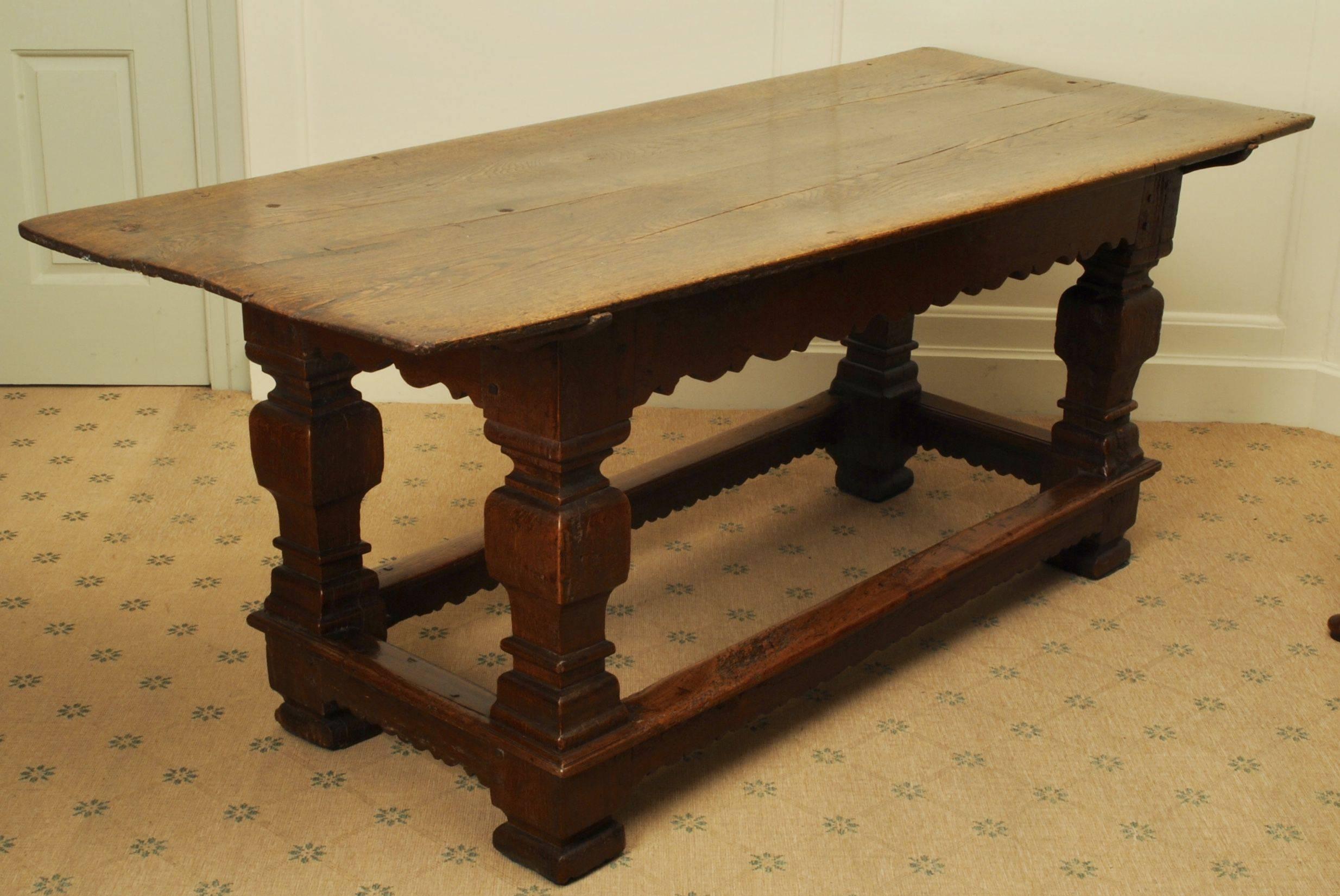 A good example of a 17th century oak table of good color standing on square baluster legs.
