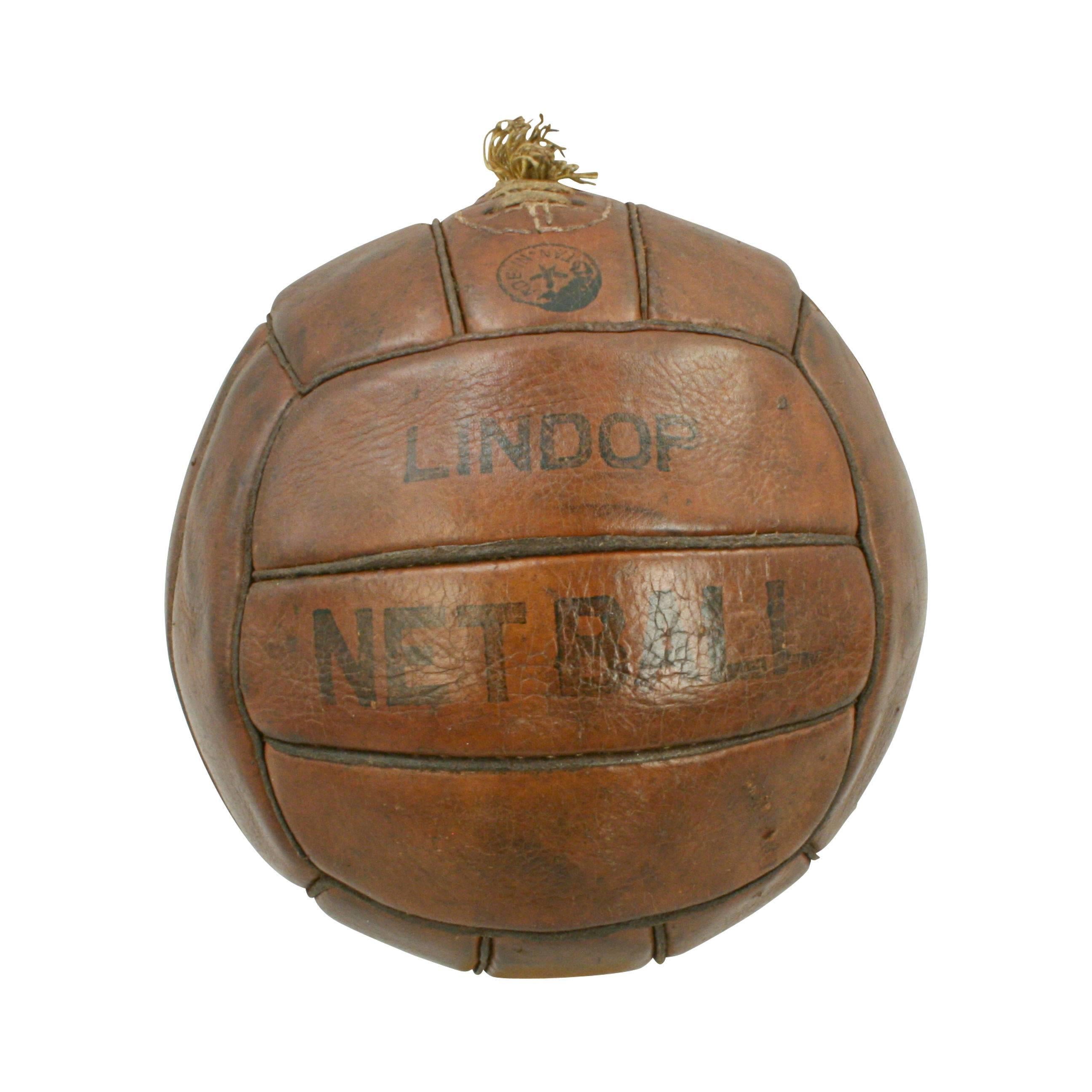 Vintage leather lindop netball. 
A traditional 18-panel tan leather netball ball in very good original condition. The ball has a lace-up slit to the top to enable bladder inflation or replacement. The ball is very similar to a football except that