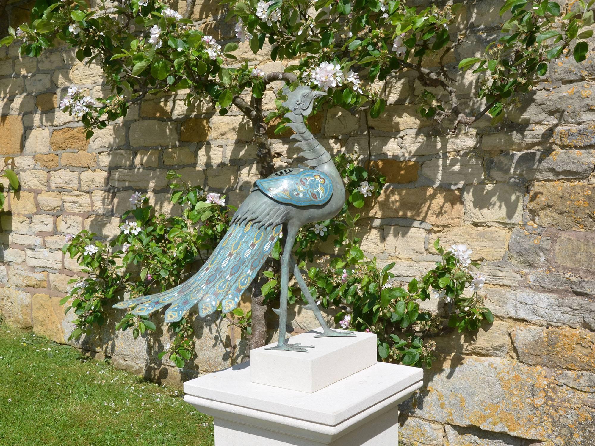 In the form of a Peacock with the head of a cockerel. The back cover perforated to let escape the incense that would have been burnt inside the cavity. The tail and wings are the most decorated with blue, white, red, green and yellow enamel filled