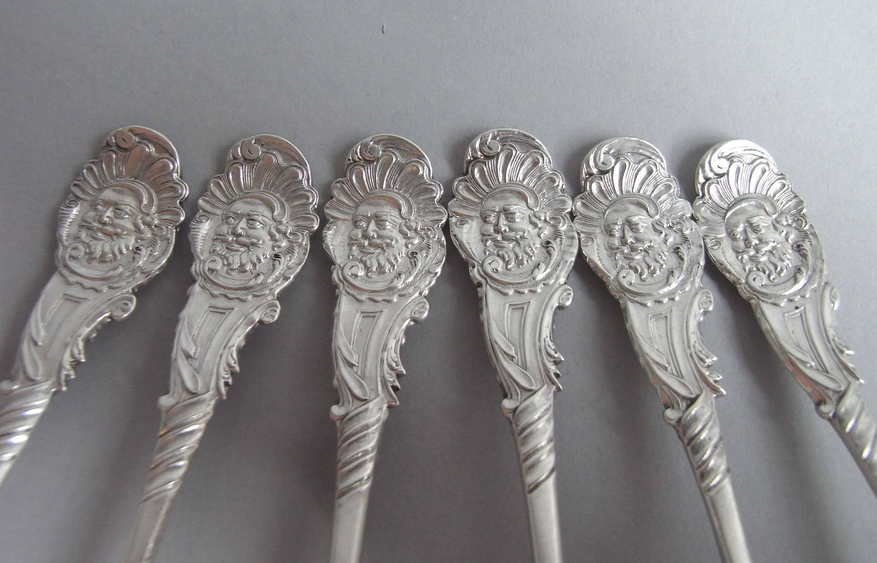 The teaspoons are of a most unusual design and are modeled in the Hanoverian style. The shaped stems display a raised bearded male mask surrounded by Rococo shell and scroll details. The reverse of the stem displays foliate designs and a vacant