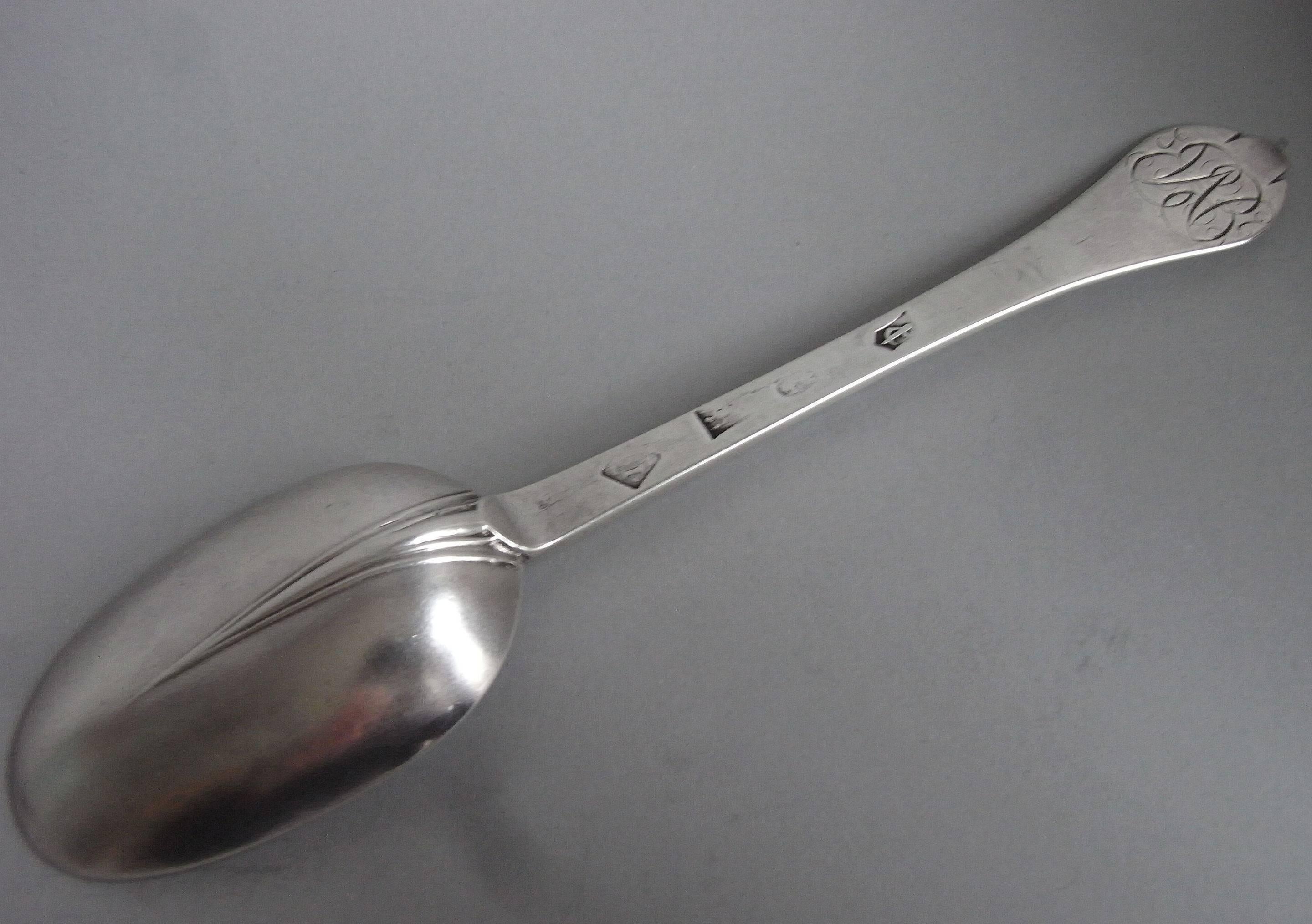 These exceptionally rare spoons are modeled in the Trefid style and display a reeded rat tail on the back of the bowl. The top of the stem is engraved with a beautifully designed mirror cipher, which was typical of this date. The spoons are in