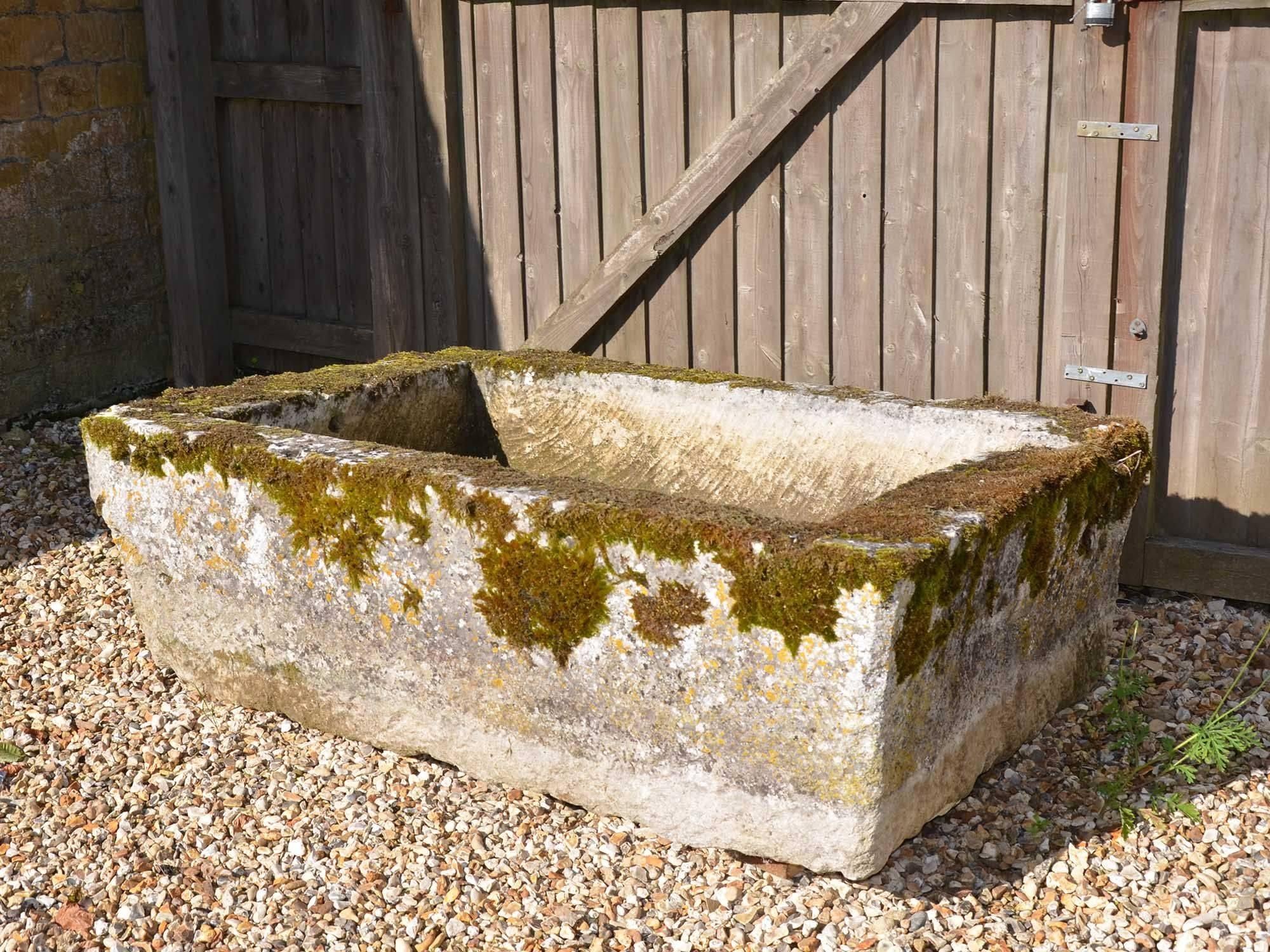 A large 18th century stone trough with good weathering and patination.