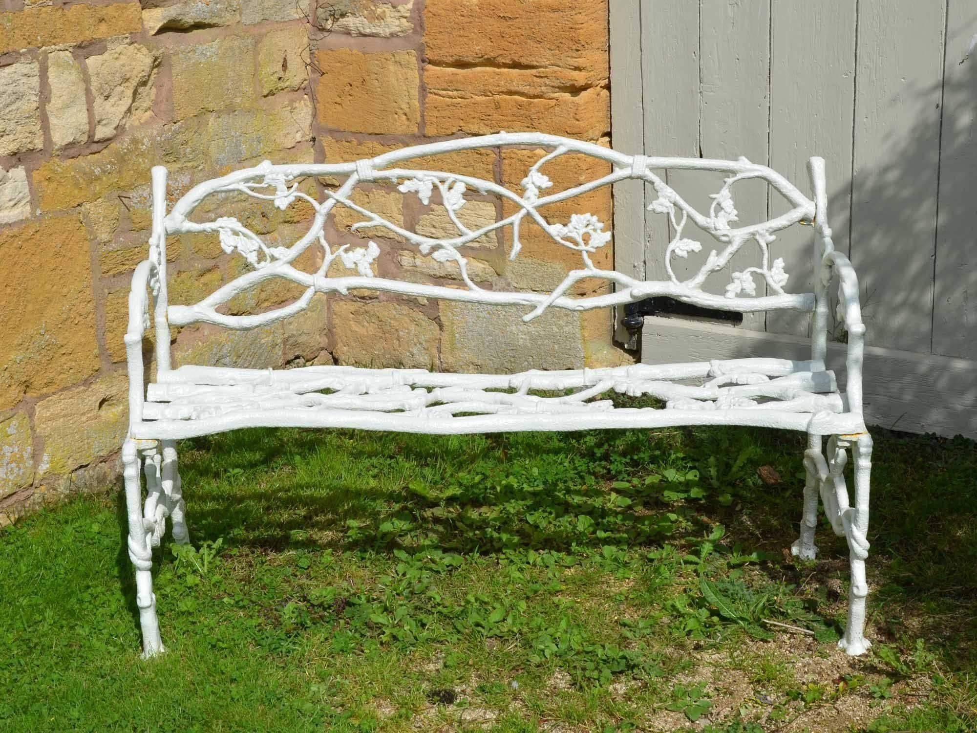 A 19th century cast iron garden seat of a twig and foliage design.