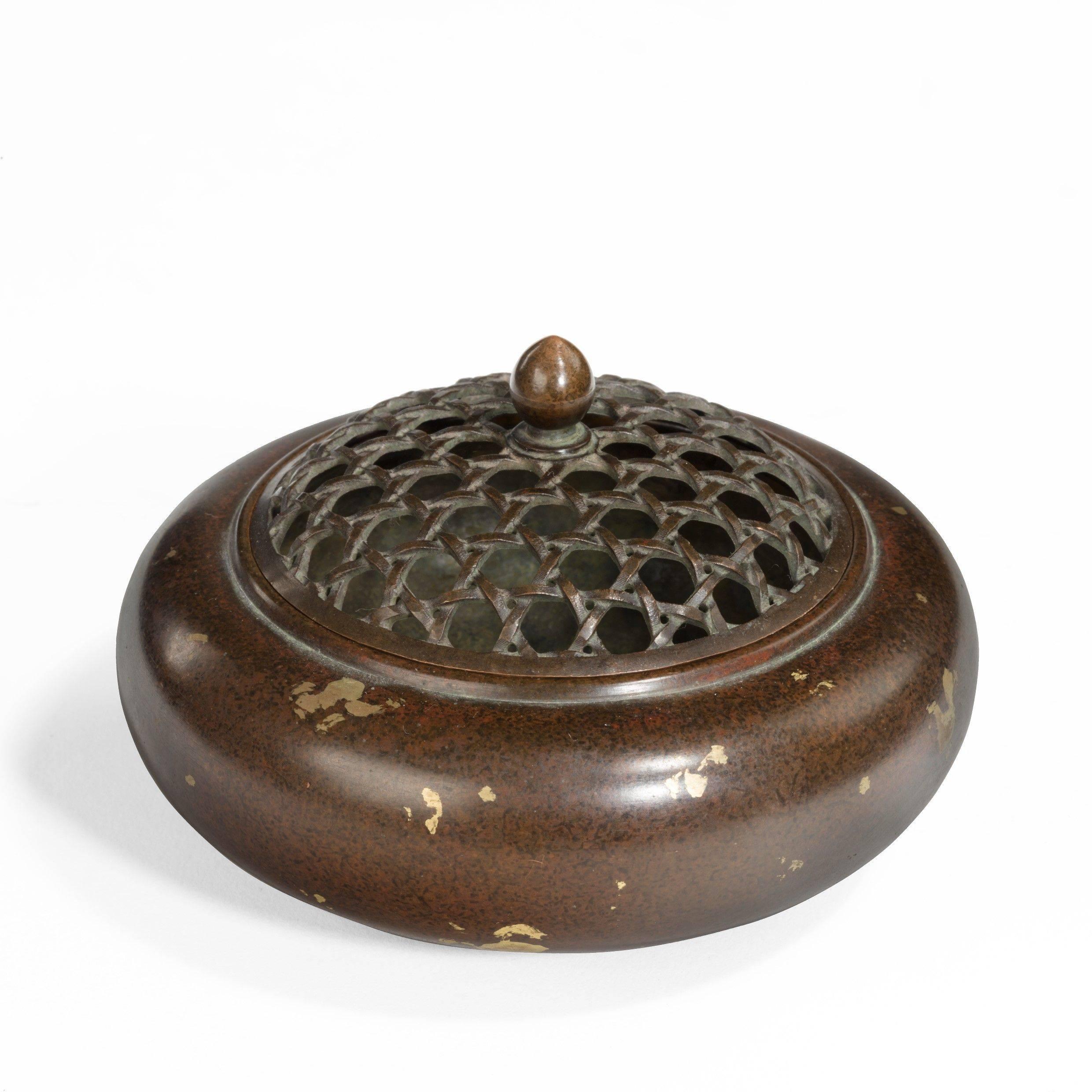 In the Chinese splash-ware style, with sprinkled gold leaf and a reticulated basket-weave cover. Signed in a seal, circa 1900.