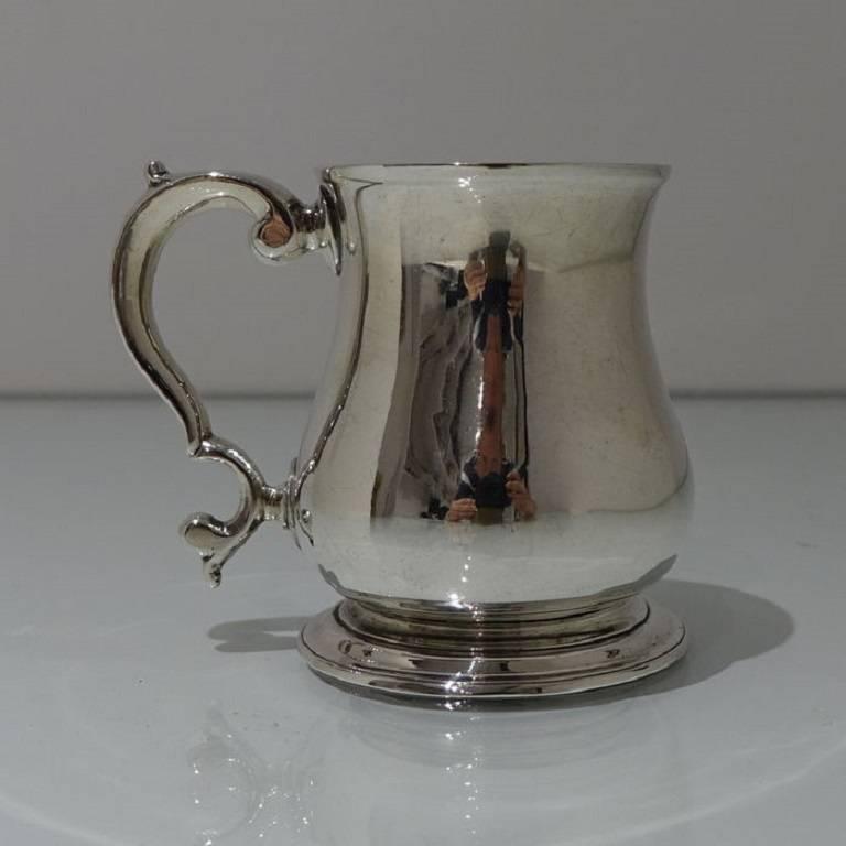 A very fine and beautifully proportioned 18th century baluster mug with a stylish cast formed double scroll handle. 

The length is 4.25 inches/10.6cm (front of rim to back of handle).