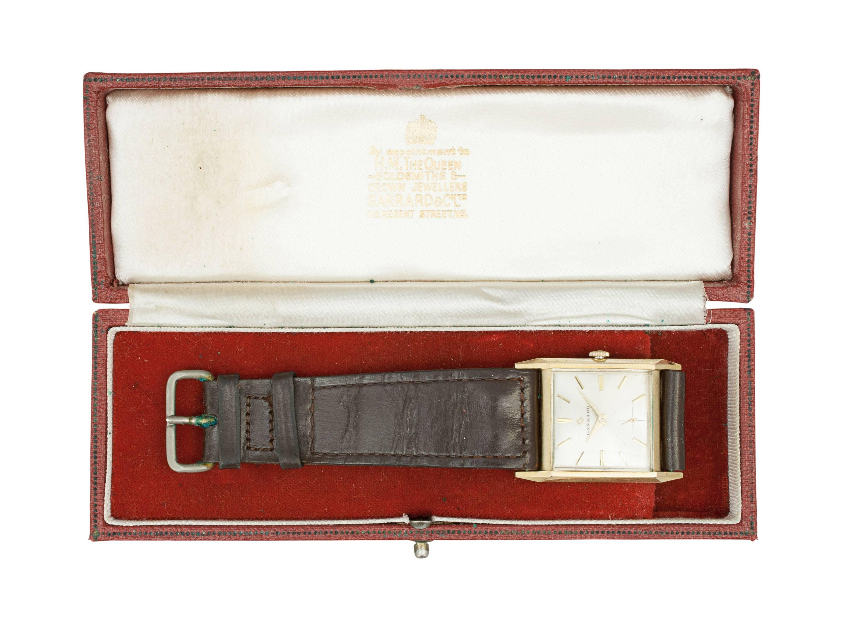 Gentleman's Garrard 9-carat gold wrist watch. 
9-carat gold Swiss mechanical wrist watch made by the world renowned premier maker Garrard, the Crown Jewelers. The watch is in its original presentation box and comes with original warranty and