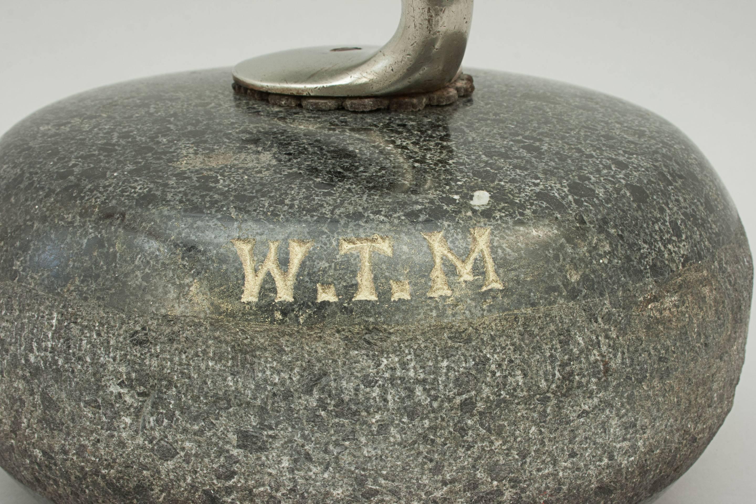 Early curling stone. 
A fine traditional double - soled granite curling stone with the owners initials W.T.M. chiselled into the stone. The stone is most probably made from granite from Ailsa Craig by Turnberry, Scotland and has a plated one-piece